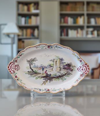 a plate with a picture of a castle on it on a table