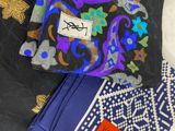 three different types of scarves on a white surface with gold and blue designs