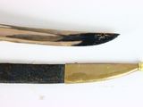 a knife and a knife blade on a white surface