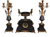 a black and gold clock sitting on top of a table