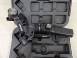 a black case that has a camera and a tripod in it