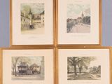 four framed watercolors of buildings and trees on a blue wall