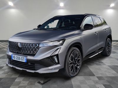 a grey 2021 toyota highland parked in a room with checkered floor