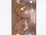 a picture of a wooden wall hanging on the wall