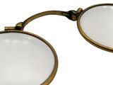 pair of antique magnifying glasses on a white background
