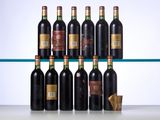 several bottles of wine are lined up on a glass shelf