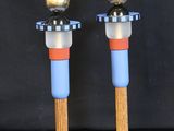 a pair of glass candlesticks in the shape of a man and woman