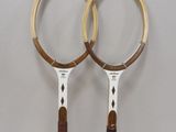 two tennis racquets that are on a table