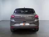 the rear end of a silver car in a white room