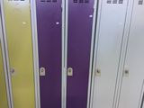 several metal lockers are lined up in a row in a room