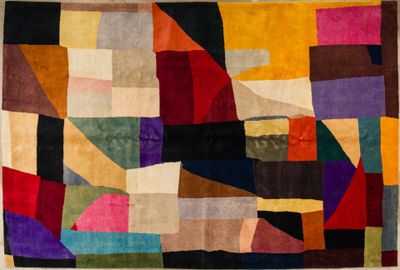 an image of a multicolored rug with squares and rectangles