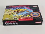 the box of the gameboy is sitting on a white surface