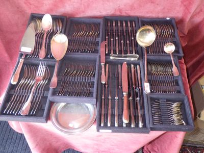 an image of a tray with silverware on a table