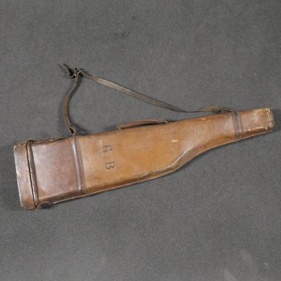 rifle case with leather lining and leather strap on grey background