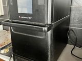 a black microwave sitting on top of a kitchen counter