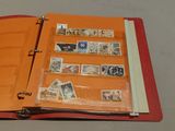a red binder with stamps on it and a red binder with stamps on it