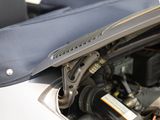 a close up of a car ' s engine with its hood open