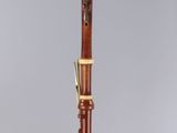 a clarinet with a wooden body and a black top