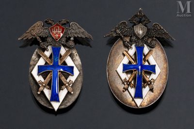 pair of silver and blue enamel badges with eagle and cross on them