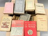 several books are stacked on top of each other on a table