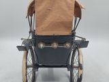 a toy carriage that is sitting on a white surface