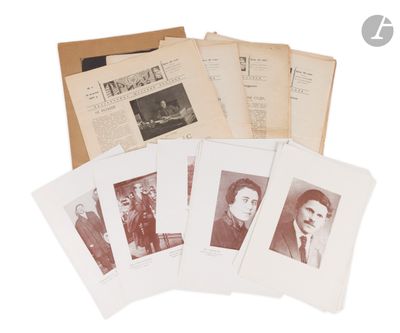 several old photographs of men in suits and ties are on a table
