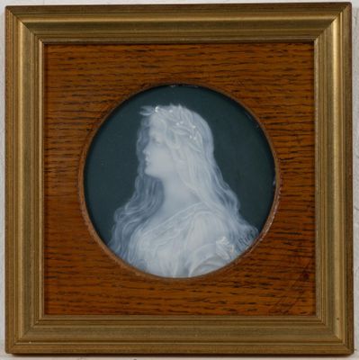 portrait of a woman in a white dress in a wooden frame