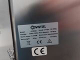 a close up of a stainless steel refrigerator with a sticker on it