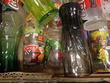 many different types of plastic bottles on the shelf