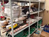 a metal shelving with lots of items on it
