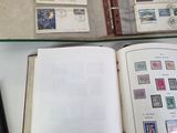a lot of stamps on a book on a table