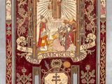 an image of a red and gold banner hanging on a wall