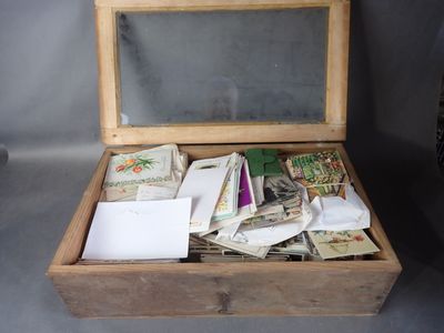 a small wooden box filled with lots of mail