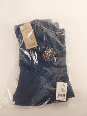 the shirt is wrapped in plastic and sitting on a table