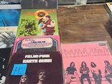 a lot of records on a table in a room