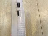 a small white device on a wooden table