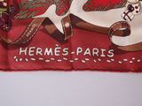 a red scarf with a picture of a snowman and a dog on it