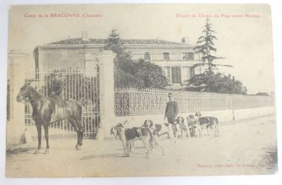 an old picture of a man on a horse with a bunch of dogs