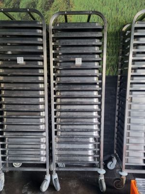 several metal trays are stacked on top of each other