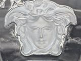 an image of a glass vase with a face on it