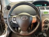 dashboard view of a car with a steering wheel and dashboard controls