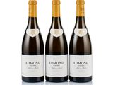 three bottles of red wine sit side by side on a white surface