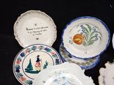 many plates that are sitting on a black table