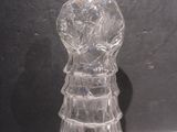 a glass figurine that is sitting on a table