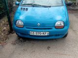 a blue car that is parked on the side of the road