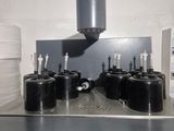 an image of a machine that has a lot of cups on it