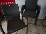 two chairs that are next to each other on the floor
