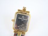a watch that is sitting on top of a table