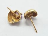 pair of gold tone earrings with amethorate stones on them