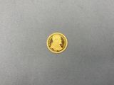 une pièce d'or portant le portrait d'un homme